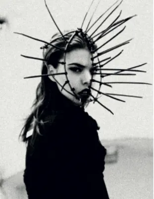 Portrait of a woman with a headdress of spikes